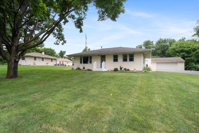 2230 Oleary Rd, Jackson, MI 49201 - ranch-style home with a front yard and a detached garage