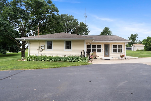 2230 Oleary Rd, Jackson, MI 49201 - ranch-style house with a front lawn and entry steps