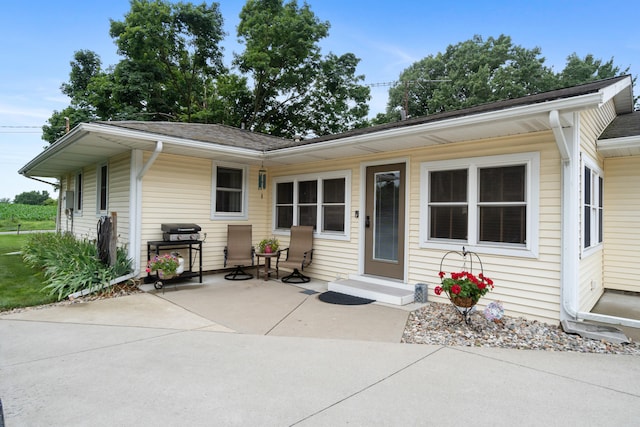 2230 Oleary Rd, Jackson, MI 49201 - view of front facade featuring a patio area and roof with shingles