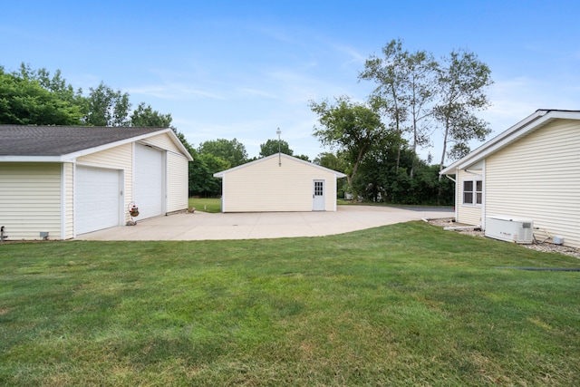 2230 Oleary Rd, Jackson, MI 49201 - view of grassy yard with an outdoor structure and a garage