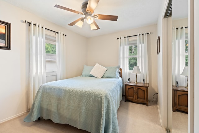 2230 Oleary Rd, Jackson, MI 49201 - bedroom with light colored carpet, multiple windows, and a ceiling fan