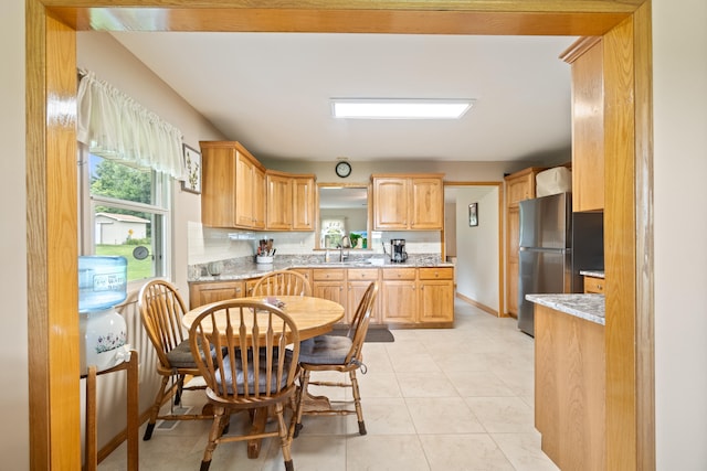 2230 Oleary Rd, Jackson, MI 49201 - kitchen with freestanding refrigerator and a sink