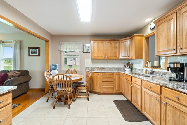 2230 Oleary Rd, Jackson, MI 49201 - kitchen with light stone countertops and light tile patterned floors