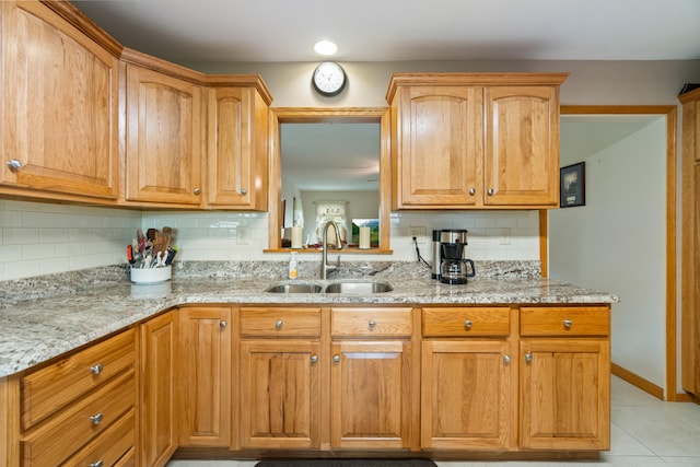 2230 Oleary Rd, Jackson, MI 49201 - kitchen featuring tasteful backsplash, light stone countertops, and light tile patterned floors