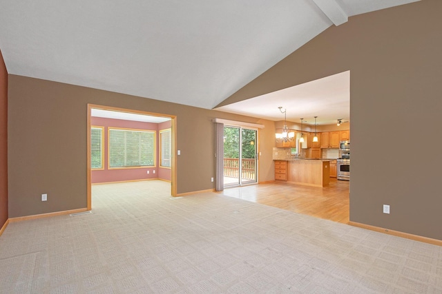 4291 Bramblewood Ct, Dorr, MI 49323 - unfurnished living room featuring light carpet and a chandelier