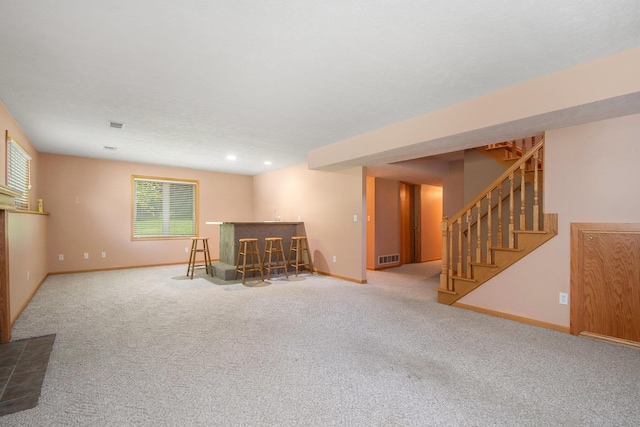 4291 Bramblewood Ct, Dorr, MI 49323 - basement featuring a bar, carpet, stairway, and recessed lighting