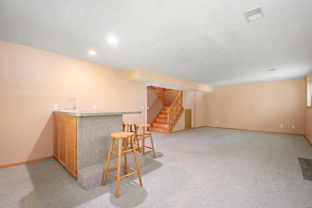 4291 Bramblewood Ct, Dorr, MI 49323 - indoor wet bar featuring light carpet, stairs, and recessed lighting