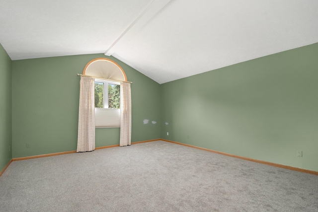 4291 Bramblewood Ct, Dorr, MI 49323 - unfurnished room featuring lofted ceiling and carpet
