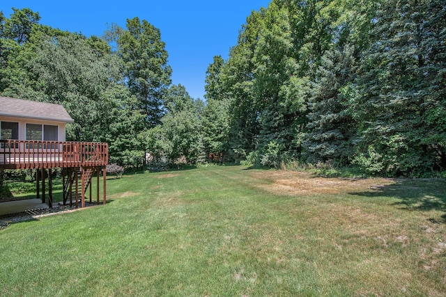 4291 Bramblewood Ct, Dorr, MI 49323 - view of grassy yard featuring stairs and a wooden deck