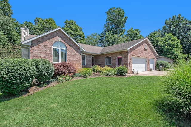 4291 Bramblewood Ct, Dorr, MI 49323 - single story home with brick siding, a garage, a chimney, and a front lawn