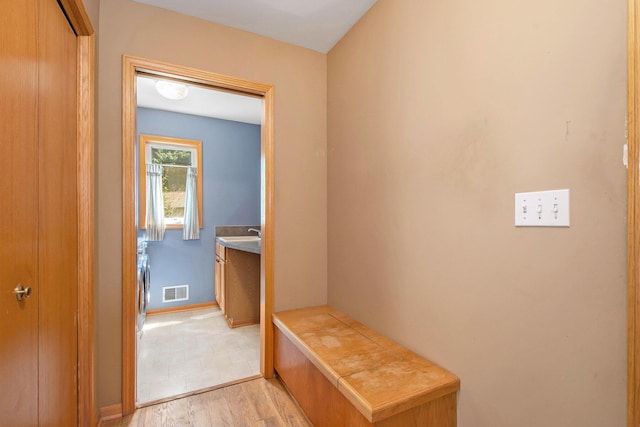 4291 Bramblewood Ct, Dorr, MI 49323 - mudroom featuring light wood-style flooring and baseboards