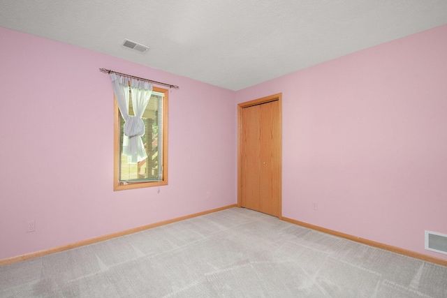 4291 Bramblewood Ct, Dorr, MI 49323 - spare room featuring light colored carpet and baseboards