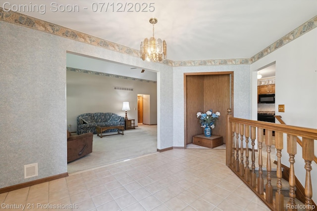 17012 Coral Ln, Macomb, MI 48042 - hall with a chandelier, light tile patterned flooring, and light colored carpet