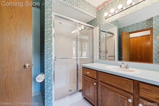 17012 Coral Ln, Macomb, MI 48042 - full bathroom featuring a stall shower, vanity, wallpapered walls, and tile patterned floors