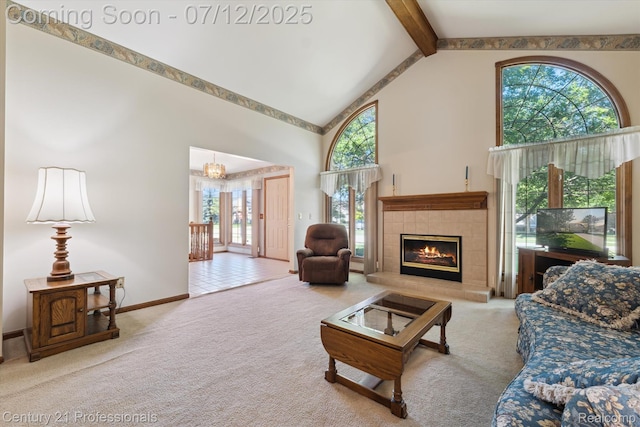 17012 Coral Ln, Macomb, MI 48042 - living room featuring high vaulted ceiling, beam ceiling, carpet flooring, and a fireplace