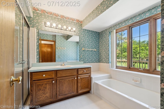 17012 Coral Ln, Macomb, MI 48042 - bathroom featuring wallpapered walls, vanity, tile patterned flooring, a garden tub, and a stall shower