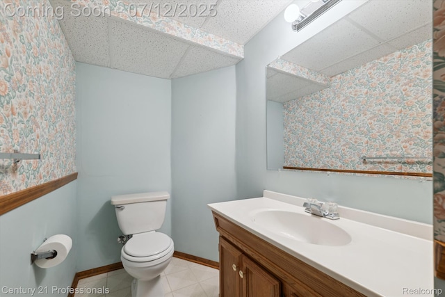 17012 Coral Ln, Macomb, MI 48042 - bathroom with a drop ceiling, vanity, and wallpapered walls