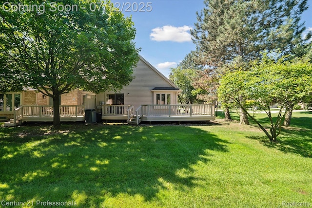 17012 Coral Ln, Macomb, MI 48042 - view of green lawn with a wooden deck