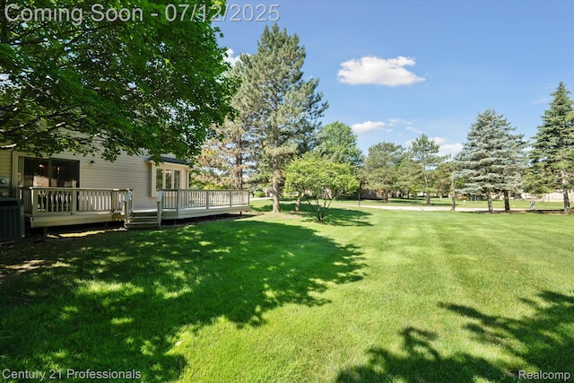 17012 Coral Ln, Macomb, MI 48042 - view of green lawn with a wooden deck