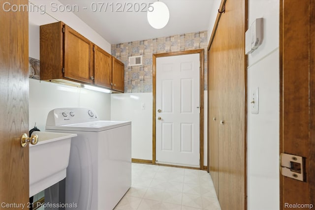 17012 Coral Ln, Macomb, MI 48042 - laundry room with washer / clothes dryer, cabinet space, and light flooring