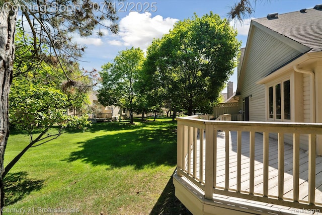 17012 Coral Ln, Macomb, MI 48042 - view of green lawn with a deck