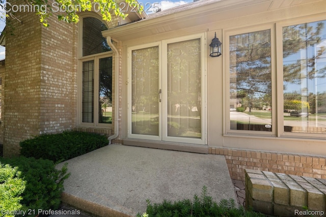 17012 Coral Ln, Macomb, MI 48042 - doorway to property featuring brick siding
