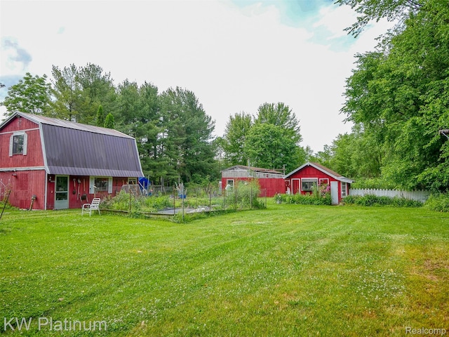 6636 Broadbridge Rd, Cottrellville, MI 48039 - view of yard with an outdoor structure and view of wooded area