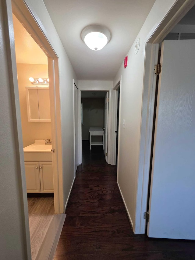 44497 Savery Dr, Canton, MI 48187 - corridor with dark wood-type flooring and baseboards