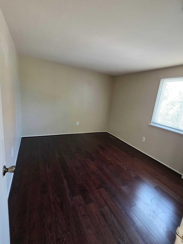 44497 Savery Dr, Canton, MI 48187 - spare room featuring dark wood-type flooring
