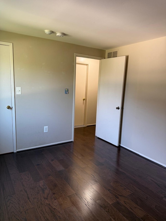 44497 Savery Dr, Canton, MI 48187 - empty room with dark wood-type flooring and a smoke detector