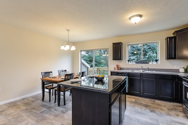 LOT128 Old Farm Dr, Wayland, MI 49348 - kitchen with a chandelier, light wood finished floors, pendant lighting, and a kitchen island