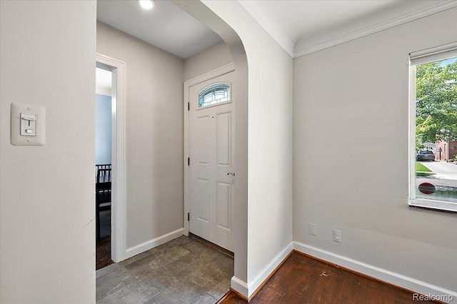 1450 Hampton Rd, Grosse Pointe Woods, MI 48236 - entryway featuring arched walkways, crown molding, and wood finished floors