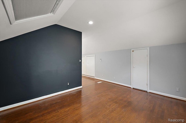 1450 Hampton Rd, Grosse Pointe Woods, MI 48236 - spare room with vaulted ceiling, wood finished floors, and recessed lighting