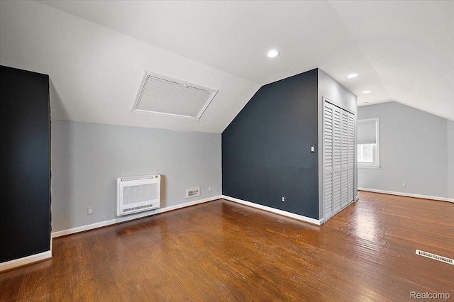 1450 Hampton Rd, Grosse Pointe Woods, MI 48236 - bonus room featuring heating unit, vaulted ceiling, attic access, wood finished floors, and recessed lighting