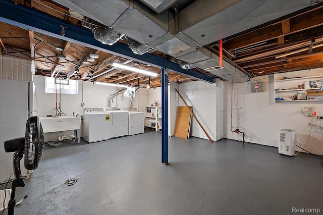 1450 Hampton Rd, Grosse Pointe Woods, MI 48236 - basement with washing machine and clothes dryer, fridge, and concrete block wall