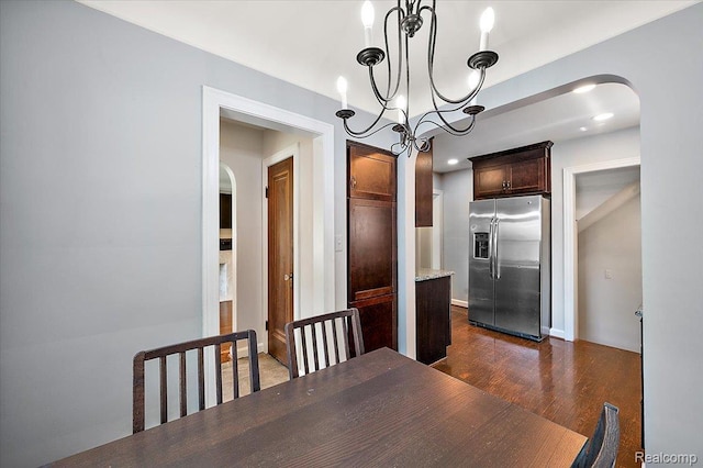 1450 Hampton Rd, Grosse Pointe Woods, MI 48236 - dining room with arched walkways, dark wood-style flooring, and a chandelier