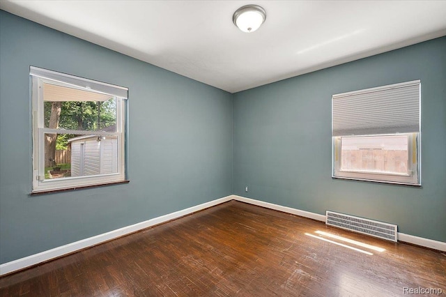 1450 Hampton Rd, Grosse Pointe Woods, MI 48236 - empty room with wood finished floors and baseboards