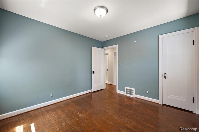 1450 Hampton Rd, Grosse Pointe Woods, MI 48236 - unfurnished bedroom featuring baseboards and wood finished floors