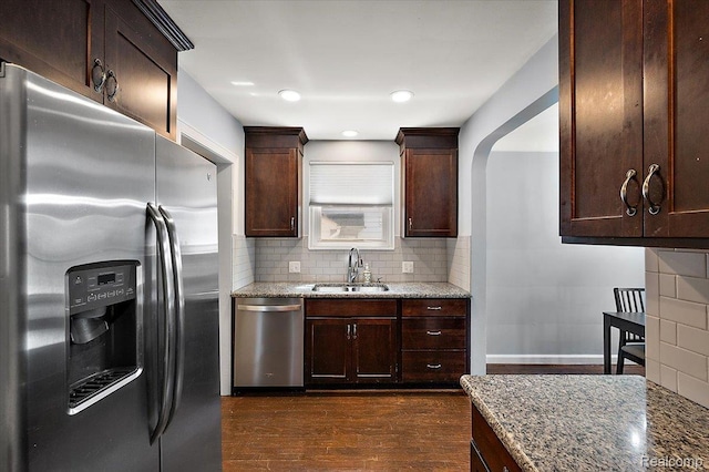 1450 Hampton Rd, Grosse Pointe Woods, MI 48236 - kitchen featuring stainless steel appliances, dark wood-style flooring, light stone countertops, tasteful backsplash, and recessed lighting