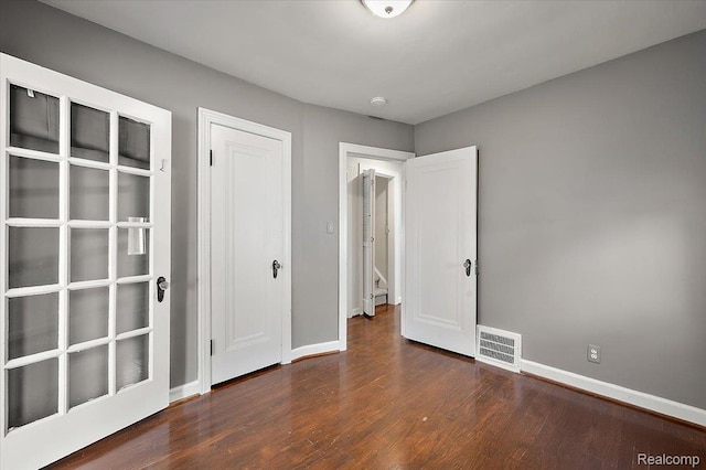 1450 Hampton Rd, Grosse Pointe Woods, MI 48236 - unfurnished bedroom featuring wood finished floors and a closet