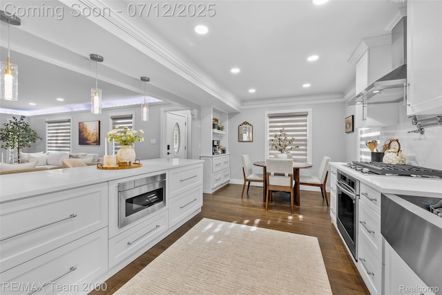 23167 Cromwell St, Canton, MI 48128 - kitchen with appliances with stainless steel finishes, white cabinets, recessed lighting, light countertops, and crown molding