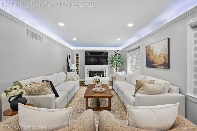 23167 Cromwell St, Canton, MI 48128 - living area with recessed lighting, a lit fireplace, and wood finished floors