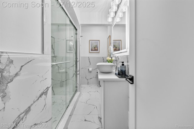 23167 Cromwell St, Canton, MI 48128 - bathroom with marble tiled flooring, a marble finish shower, vanity, and tile walls