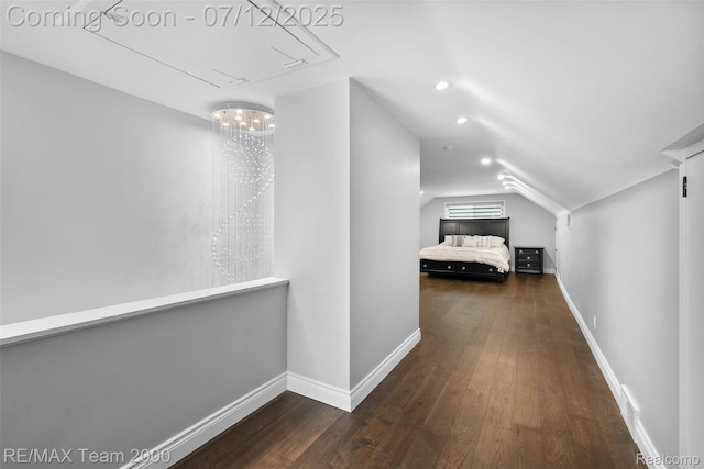 23167 Cromwell St, Canton, MI 48128 - hallway featuring vaulted ceiling, attic access, and hardwood / wood-style floors
