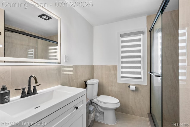 23167 Cromwell St, Canton, MI 48128 - full bath with a stall shower, vanity, tile walls, and wainscoting