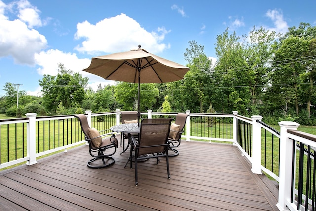 2448 Meadow Hills Dr, Ann Arbor, MI 48108 - wooden terrace featuring outdoor dining space, a lawn, and view of scattered trees