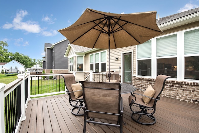 2448 Meadow Hills Dr, Ann Arbor, MI 48108 - deck featuring outdoor dining space and a lawn