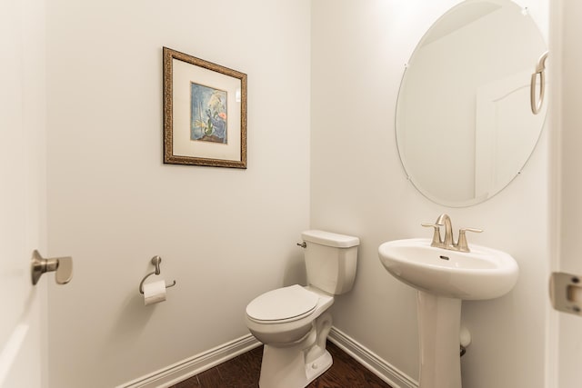 2448 Meadow Hills Dr, Ann Arbor, MI 48108 - half bathroom with baseboards and wood finished floors
