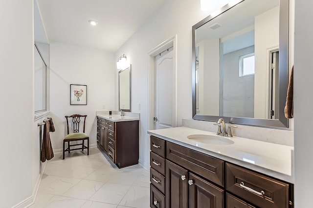 2448 Meadow Hills Dr, Ann Arbor, MI 48108 - full bathroom with marble look tiles, two vanities, a shower, and recessed lighting