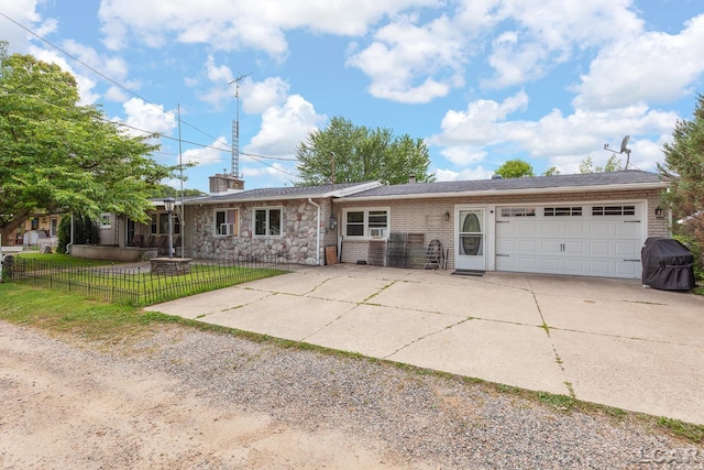753 Vaniman Island Dr, Brooklyn, MI 49230 - single story home featuring driveway, an attached garage, stone siding, and a chimney